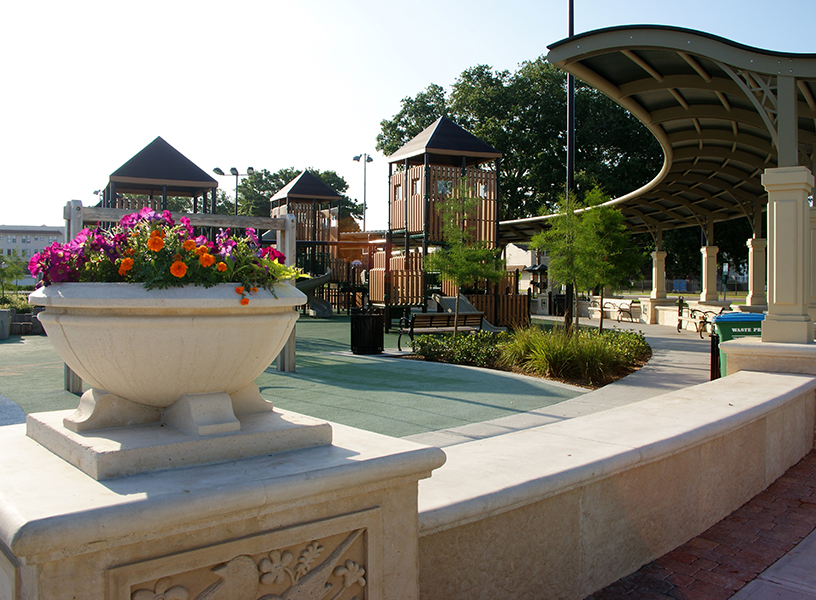 Color flower arrangements adorn the potted walls that surround the children's playground at Fort Mellon Park in Historic Downtown Sanford.