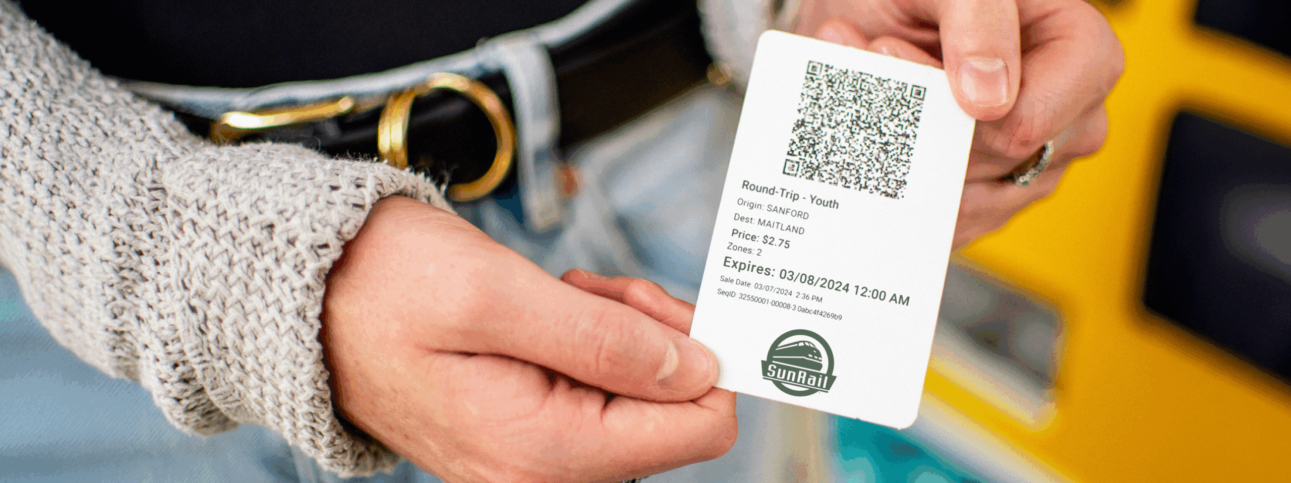 Masthead image - Woman holding a new SunRail ticket