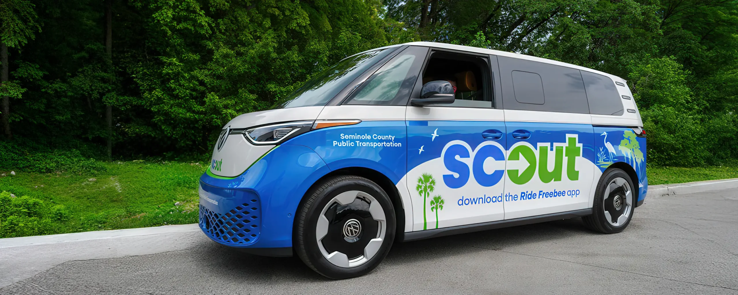 Scout van parked at curb.