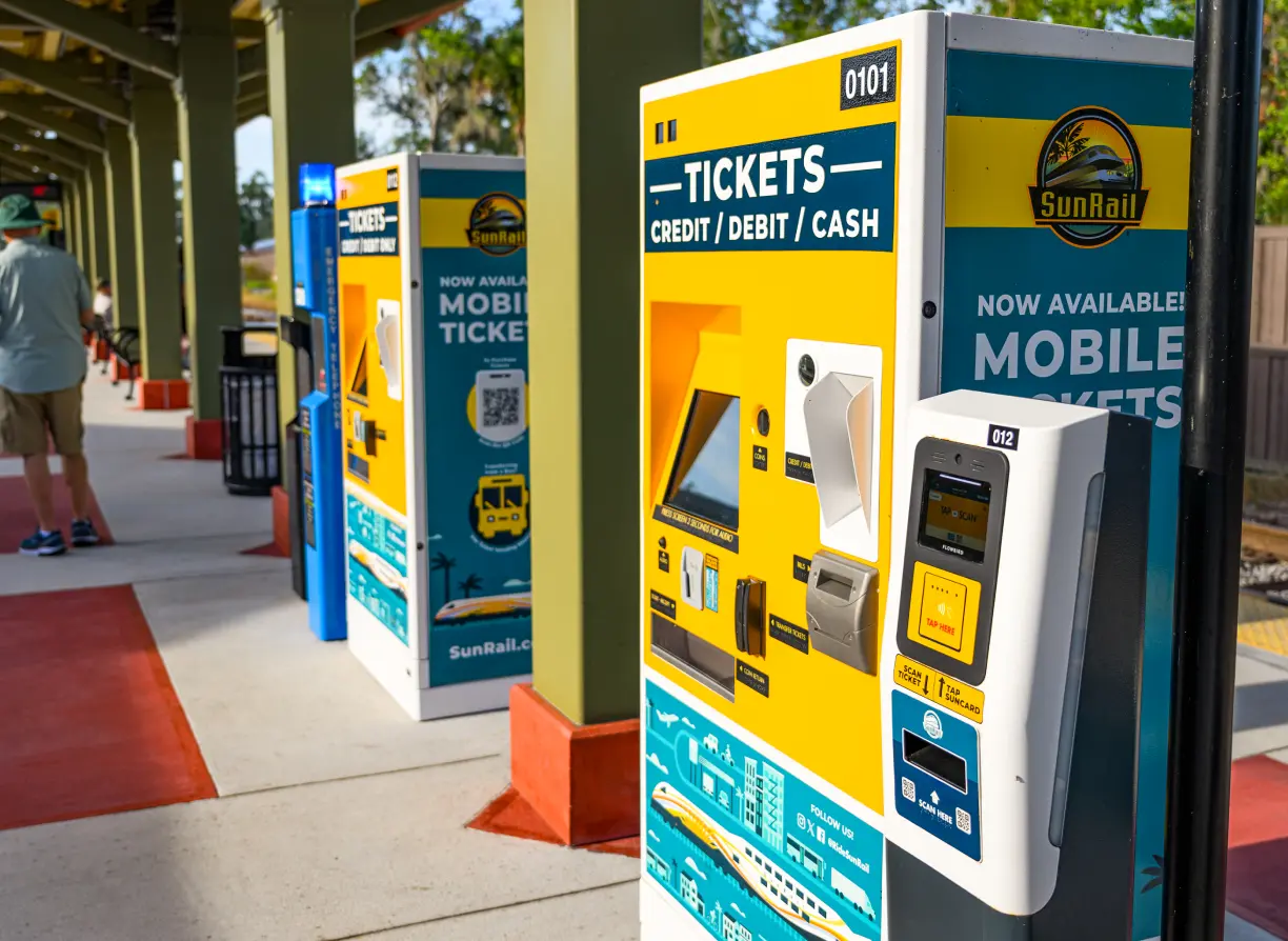 Ticket vending machines and ticket validator on the station platform.