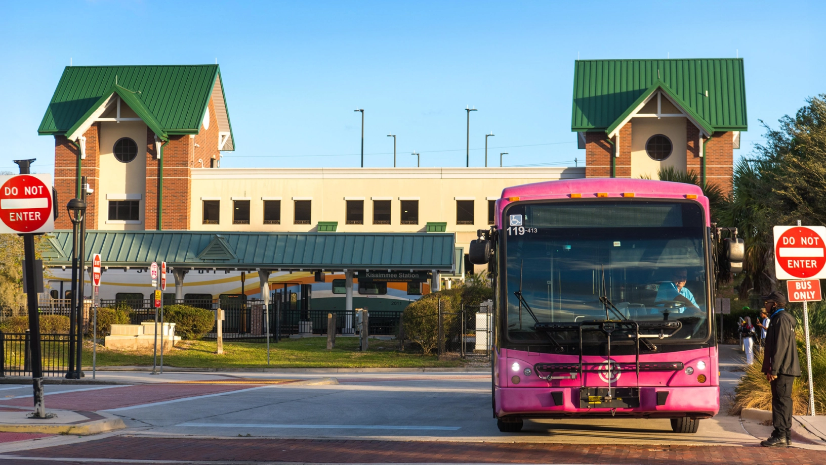 A LYNX bus waits to exit the Kissimmee/Amtrak SunRail Station.